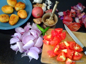 fry the potatoes & chop the onions, tomatoes