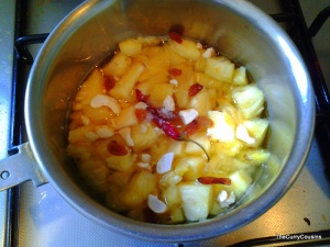 boil the pineapple pieces i water and sugar with raisins and whole red chilli